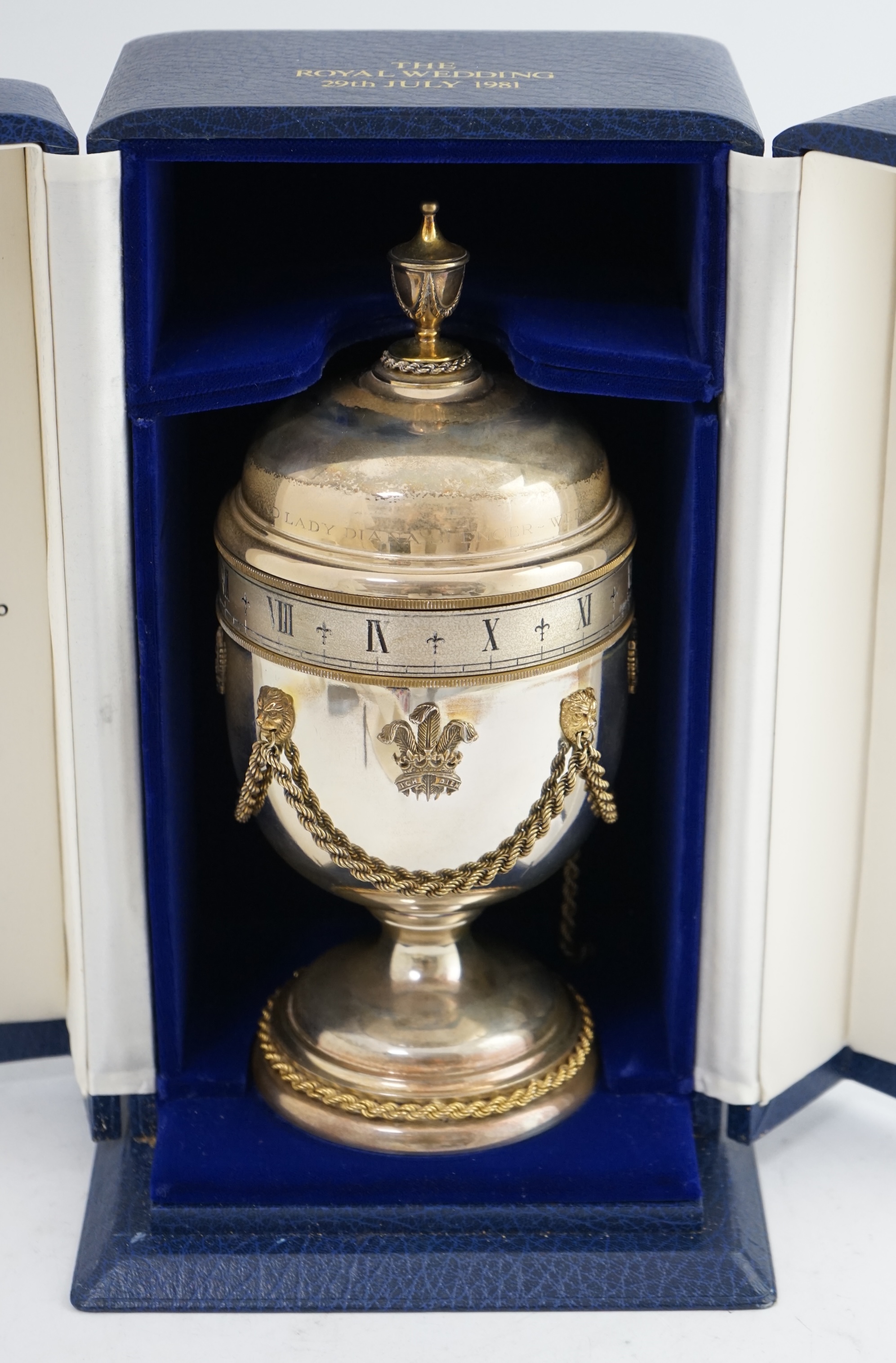 A cased Limited Edition Commemorative Prince of Wales and Lady Diana Spencer 1981 Royal Wedding 'Prince of Wales' silver eight day manual wind clock, by Mappin & Webb